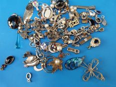 A quantity of silver/ white metal pendants to include quartz set, abalone, moonstone,