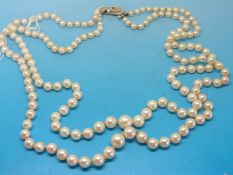 A pearl two strand necklace made up of two strands with a 9ct white gold clasp set with eight