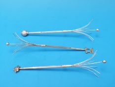 Three Japanese white metal swizzle sticks,