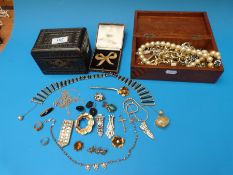A collection of costume jewellery to include paste necklaces, brooches, a silver cross pendant,