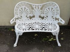 A cast aluminium bench with pierced decoration