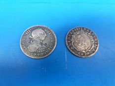 A Charles III Spanish two Real piece 1774 together with a continental 1699 silver coin