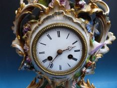 A French clock on stand with hand painted ceramic decoration,