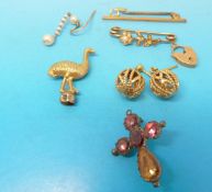 Two yellow metal brooches; one set with seed pearls,