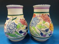 A near pair of Poole vases