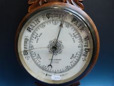 An early 20thC aneroid barometer with mercury thermometer dial marked Lennie & Thomson Dundee