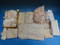 A box of approximately forty rolls of vintage ribbon together with a box of mainly 19thC lace