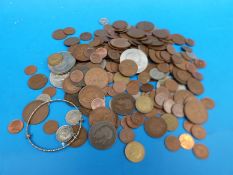 A small tin of largely UK coins, modern crowns etc,
