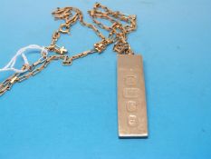 A 9ct gold ingot on a 9ct gold chain formed of rectangular links (21.