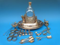 A white metal mounted dimple bottle, mount stamped 800, similarly marked sugar tongs,