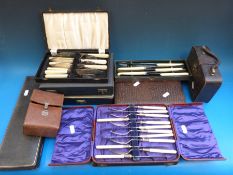 A quantity of boxed plated cutlery sets,