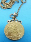 A 1913 gold full sovereign with mount and chain marked 9ct (14.