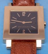 An 18ct gold Bulgari wristwatch with black dial with date aperture on brown leather strap with 18ct