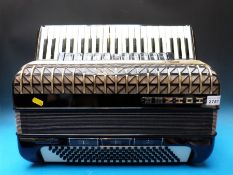 A c1970 Hohner Atlantic IV deluxe 120 bass piano accordion, 11 couplers treble side,