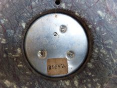 An aneroid barometer set in a serpentine stone case