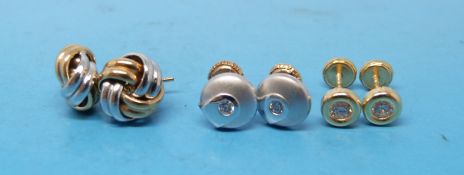 A pair 9ct gold bi-coloured knot earrings and two other pairs
