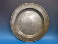 An 18thC pewter charger with touch marks WWK