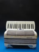 A c1960 Hohner Tango IM with 96 bass two voice treble,