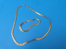 A gold filled matching necklace and bracelet in case