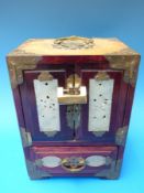 A Chinese jewellery cabinet with jade plaques inset,