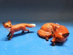 Two Beswick foxes