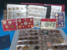 An amateur unsorted coin collection, three albums in total,