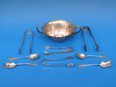 A pair of hallmarked silver sugar nips together with a silver plated twin handled bowl and a