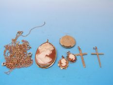 Four 9ct gold/ yellow metal chains, a cameo pendant/brooch with 18ct gold mount,