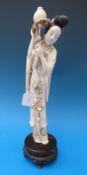 A Chinese large ivory  figure of a lady with flowers (42cm tall)