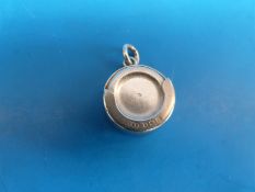 A hallmarked silver half sovereign holder decorated with  St Christopher and inscribed 