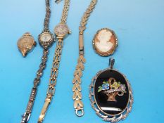 A 9ct gold ladies watch, a 9ct gold strap, a silver ladies watch set with marcasite,