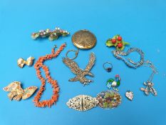 Costume jewellery to include large silver marcasite brooch in the form of an eagle, coral necklace,
