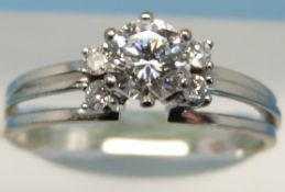 An 18ct white metal ring set with a solitaire diamond measuring approx 0.