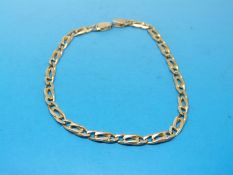 A yellow metal bracelet marked 750 (7g)