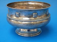 An Arts and Crafts hammered silver pedestal bowl, by Goldsmiths and Silversmiths, London 1927.