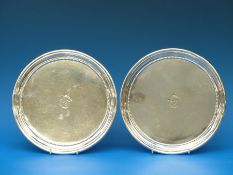 A pair of Georgian hallmarked silver salvers of circular design with beaded border,