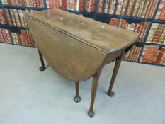 A 19thC mahogany drop leaf table with shaped apron cabriole legs and pad feet,