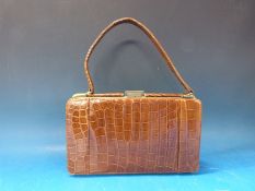 A vintage crocodile skin handbag