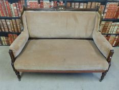 An Edwardian upholstered sofa with line inlay