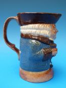 A late 19thC Doulton Lambeth Toby clutching two bags of money No. 8572 (15.