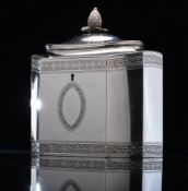 A Georgian hallmarked silver tea caddy, of neoclassical form with incuse corners,