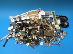 A large collection of wristwatches and novelty miniature clocks together with straps and bracelets