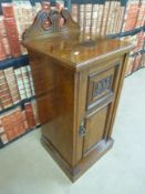 A C19th carved walnut pot cupboard (W39.