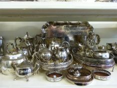 A large collection of plated ware including trays, tea sets, cruet,