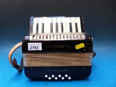 A Hohner 'Mignon' 8 bass children's accordion finished in black (tiny but not a toy)