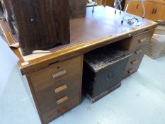A retro pedestal desk with slide and seven variously sized drawers to each side (W152 x D92 x L71.