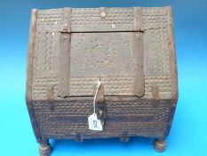 A carved wooden metal bound North African casket,