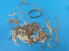 A quantity of white metal / silver necklaces, bracelets, brooches, tri-coloured silver necklace,