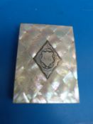 A mother of pearl card case with engraved diamond shaped panel to front together with a small