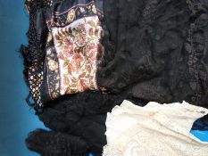 An embroidered shawl together with various other textile